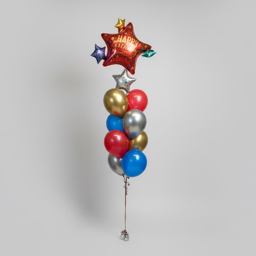 Decorative balloons with 'Happy Birthday' in a store aisle