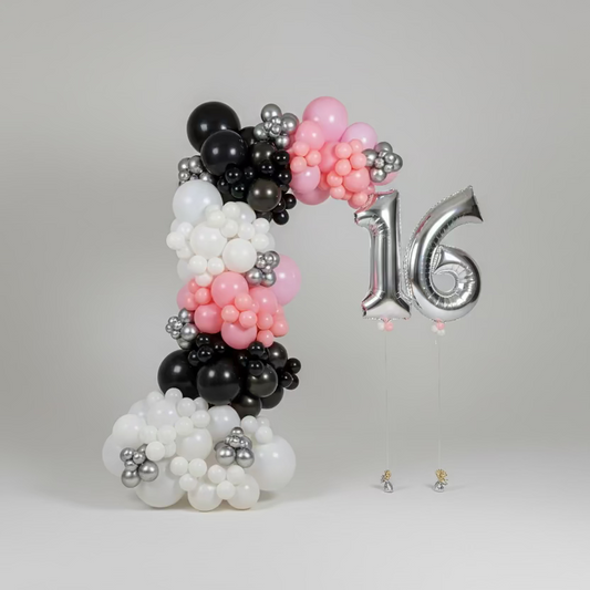 Balloon sculpture in the shape of the number '16' with black, pink, and silver balloons on a white background.