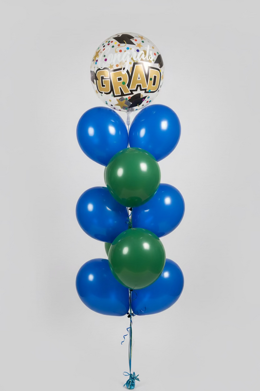 Bunch of balloons with 'Congrats Grad' text in a store setting