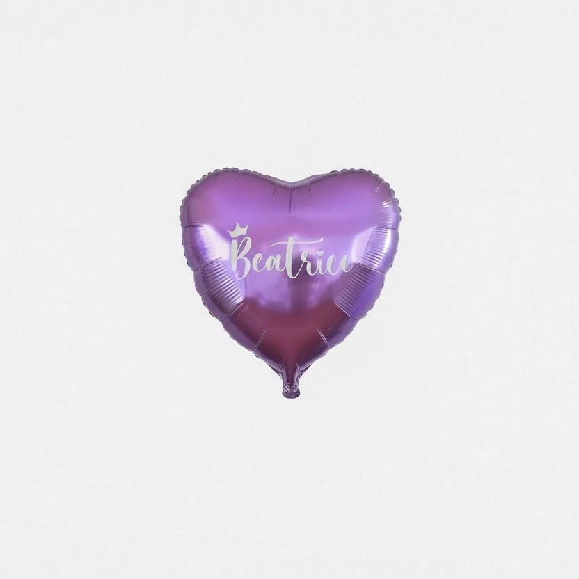 Heart-shaped purple balloon with 'Beatrice' printed on it against a tinsel curtain background.