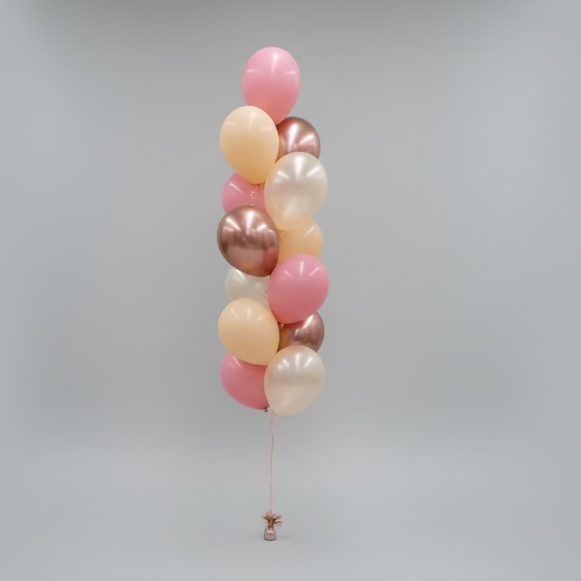 Three balloon columns in pink, gold, and bronze on a plain background